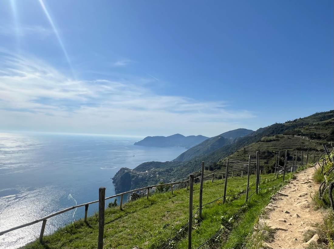 A mountain trail winding through open country